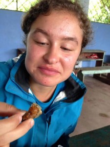 Aimee Schneider, MSID Ecuador 2014, considers her worm carefully before taking the first bite. There are all types of learning while abroad - even learning to eat worms!